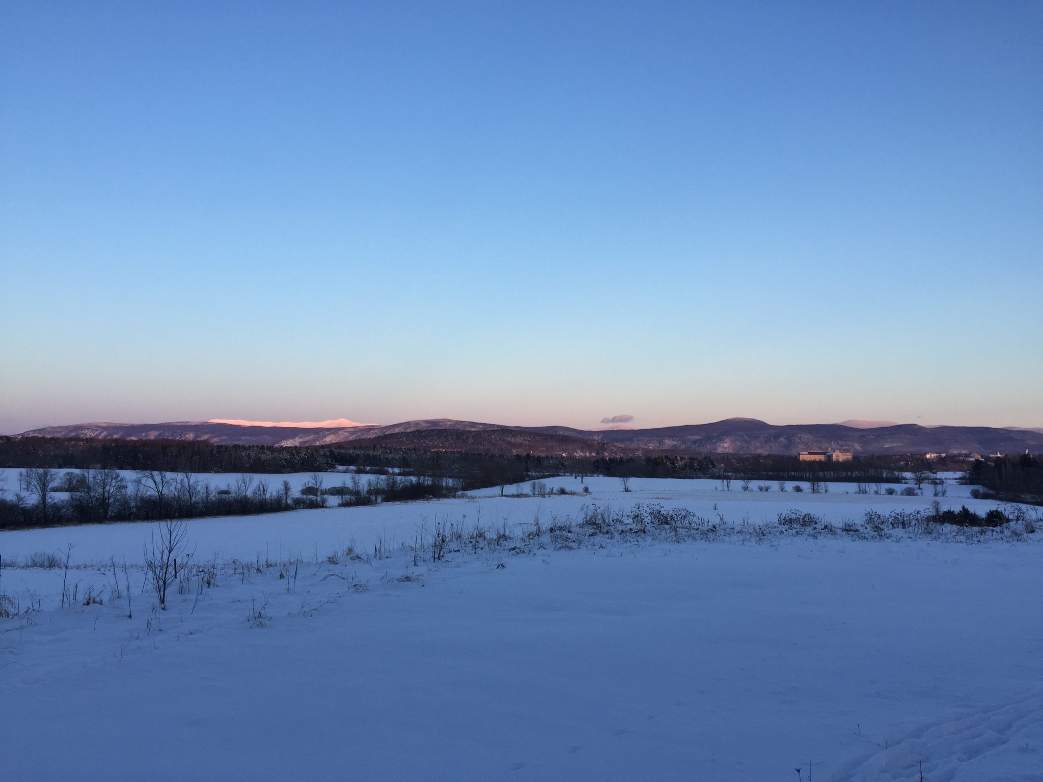 photo of snowy mountains at sunset