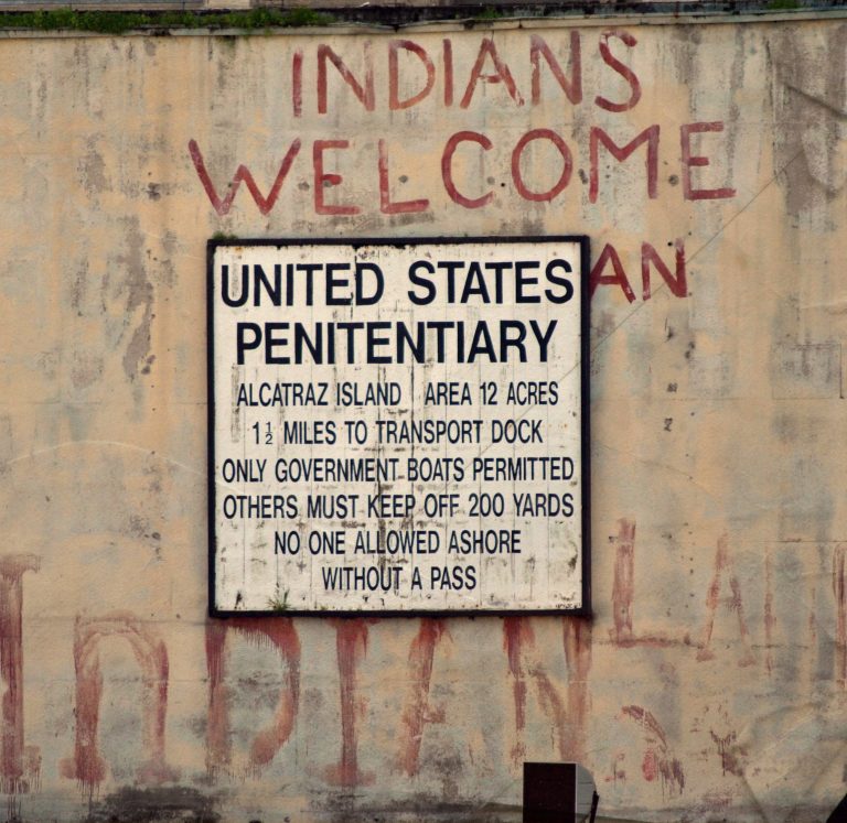 Alcatraz island occupation graffiti on the federal penitentiary sign.