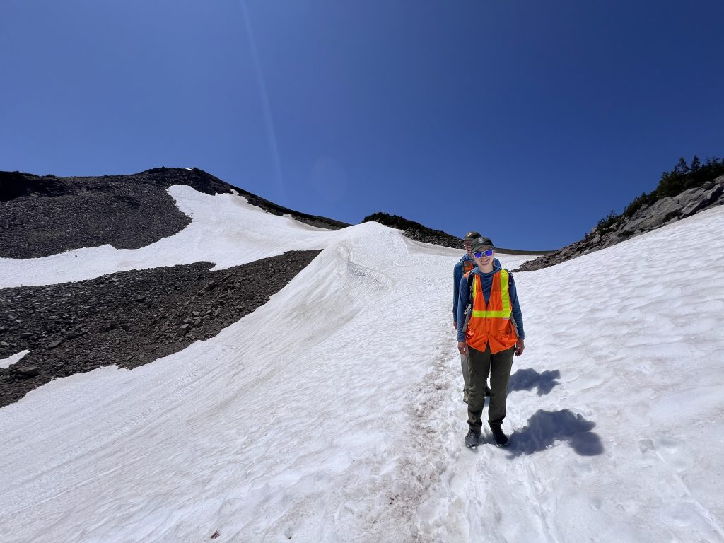 Image of Alison Munaylla-Bohorquez, recipient of the Mosaics in Science Standout Communications Award, standing on a glacier.