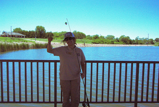 Genevieve and a bluegill at the fishing derby at 605 Unity Jam Event