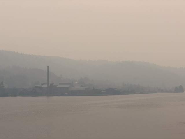 Smoke across the water covering the smelter